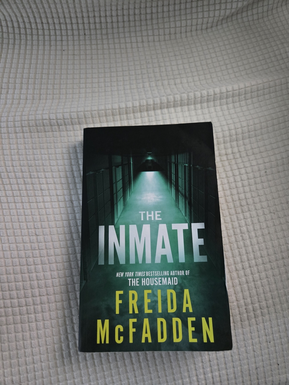 The Inmate by Freida McFadden - Green & Black Thriller Paperback